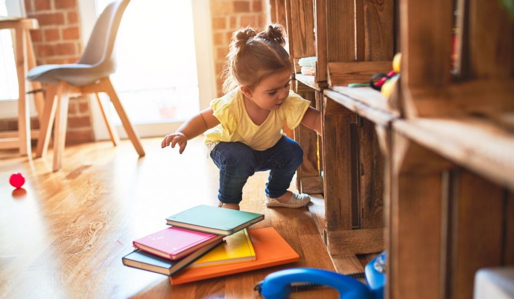 a toddler exploring the cubbies