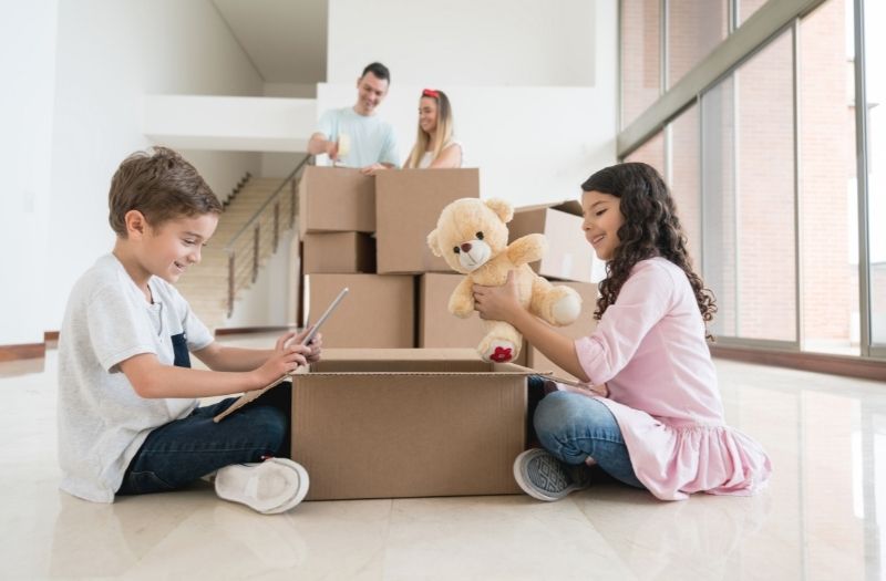 family of four moving into a new house