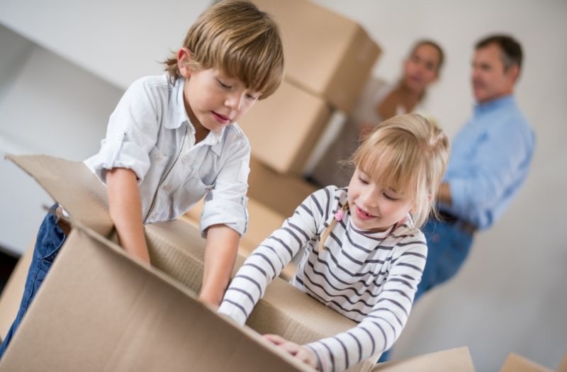 kids helping to pack things in the boxes