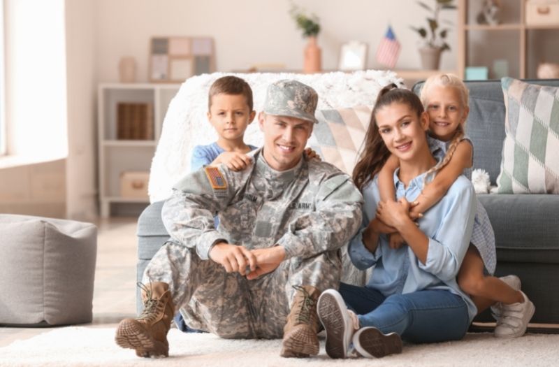 military dad with his family at home