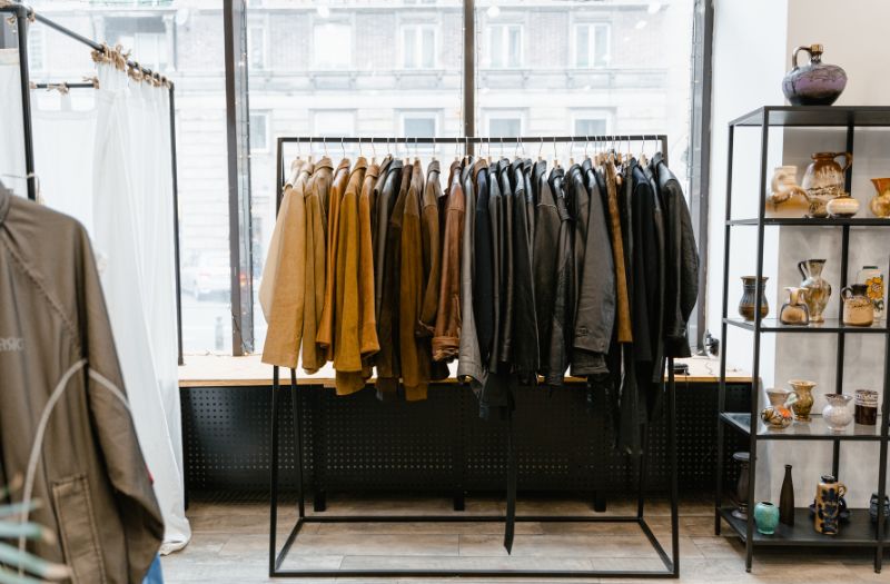 clothes rack with a bunch of jackets