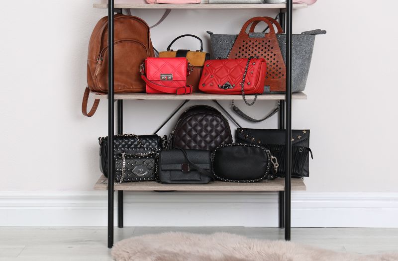 different bags on an open shelve rack