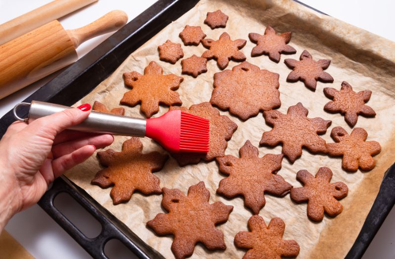 woman baking snowflakes cookies