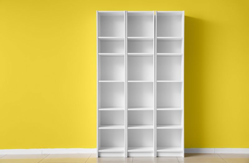 vertical shelving cabinet on a yellow storage unit