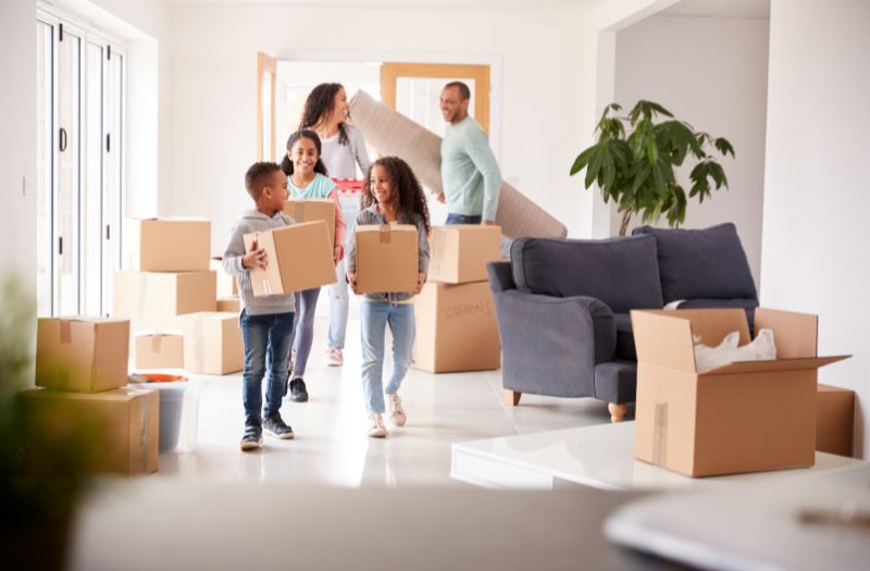 family coming into their new home